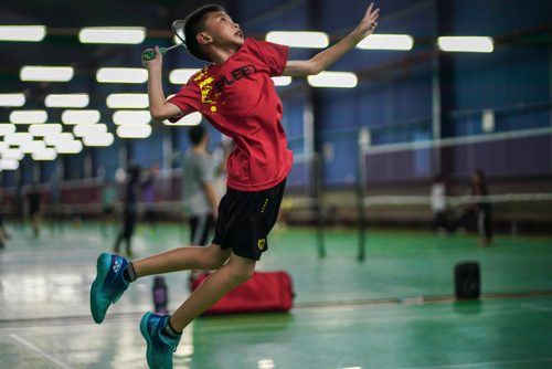 Child playing Badminton